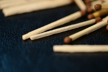Scattered matches on dark background close up
