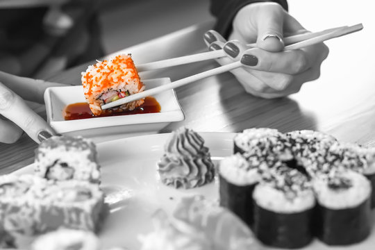 sushi rolls, Japanese cuisine, hand dipped in soy sauce,
