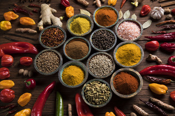 Spices and herbs in wooden bowls. Food and cuisine ingredients