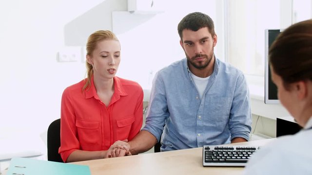 couple visiting doctor at family planning clinic