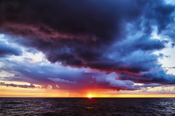 Naklejka na ściany i meble Fantastic stormy sunset on the Baltic sea