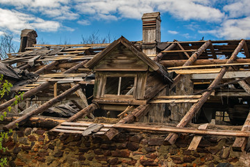 An old abandoned ruined wooden building. Big destroyed house