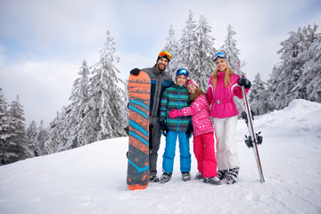 Fototapeta na wymiar Happy family enjoying in winter vacations together