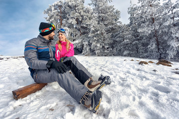 winter love -couple enjoying on winter vacation together on the mountain