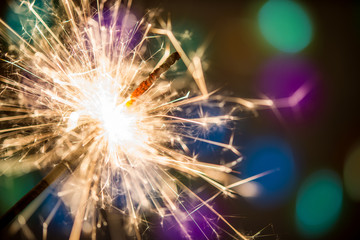 Christmas or New Year holiday background with sparkler