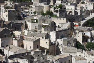 Fototapeta na wymiar View from the top of the hill to the quarter of the ancient city of Matera. Italy, Europe.