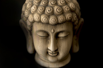 Fototapeta na wymiar Image of the Buddha on a background of a black color