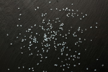 Decorative blue sugar crystals on black background