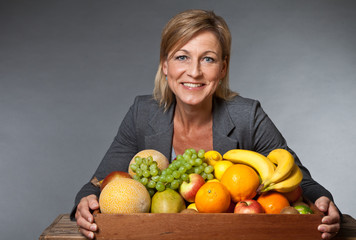 Obraz premium Fruits and blond cute woman