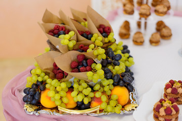 sweet desserts with berries and fruit served on the buffet.the fruit served on the buffet