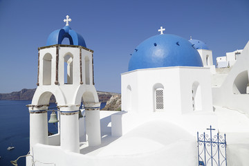 Churches with blue domes in Oia town on Santorini island, Greece