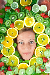 Fruits and blond cute woman portrait © jeancliclac