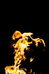 Fire flames at night, fire is very hot and warm. Beautiful of Fire flames on black background, abstract fire , All Movement Blurred, intention out of focus, and high low exposure contrast