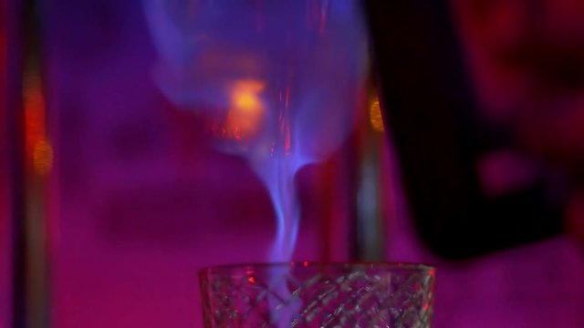 creation of an alcoholic beverage close-up. liquid fire