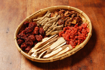 Different kind of Chinese herbal medicine in bamboo basket