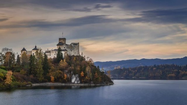Sunset at Niedzica castle by lake in autumn, Poland, Timelapse