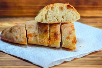 sliced homemade bread on a wooden background
