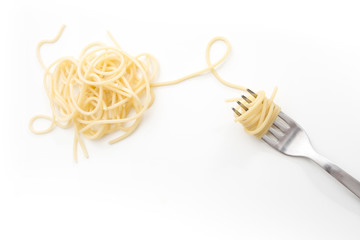 Plain cooked spaghetti pasta on fork, on white background.