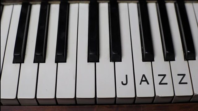 JAZZ written on white piano keys