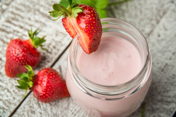Strawberry yogurt in a glass jar