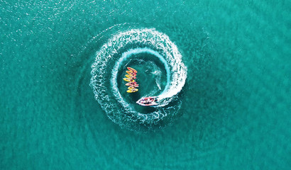 Aerial top down view os slalom made by speed boat on a Kayak sailing instruction