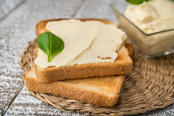 homemade appetizing crostini with soft cheese cream herbs