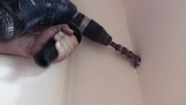 Electric Demolition Jack Hammer Heavy Drill makes large holl on wall for new Air Conditioner Installation
