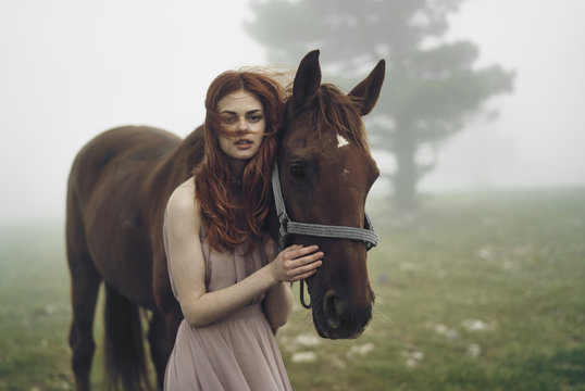 Young woman with horse