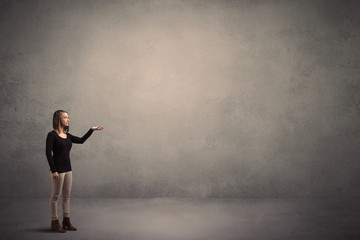 Woman standing in front of a blank wall