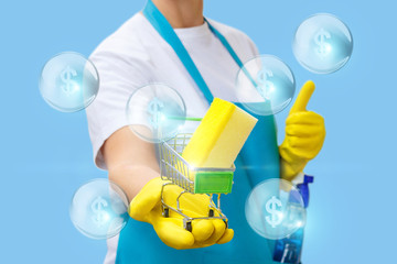 Fototapeta premium Cleaner in hand shows the shopping cart with a washcloth.