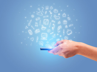 Hand with phone and drawn office icons