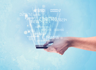 Hand holding phone with digital numbers