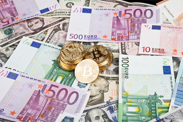 bitcoin coins with euros and dollars