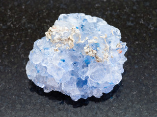 raw celestine stone on dark background