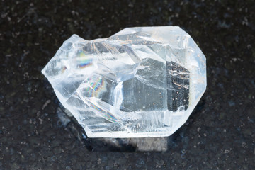 raw crystal of celestine stone on dark background