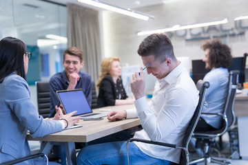 Startup Business Team At A Meeting at modern office building