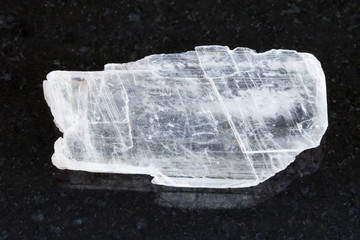 rough crystal of Gypsum gemstone on dark