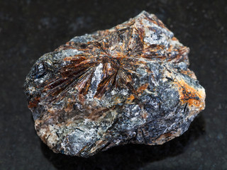 raw lamprophyllite stone on dark backgroun
