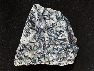 raw lujavrite stone on dark background