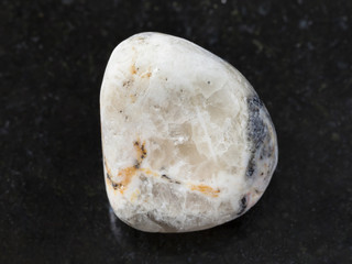 Fototapeta na wymiar tumbled baryte stone on dark background