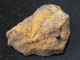 Fototapeta premium rough limonite stone on dark background