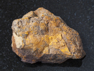 raw limonite stone on dark background