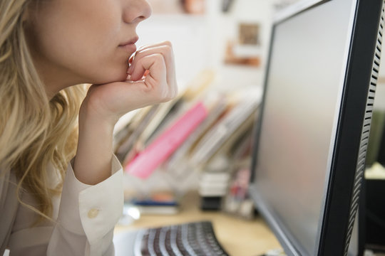 Close-up Of Woman Reading On Computer