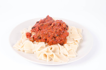 Pappardelle with bolognese sauce on a white background