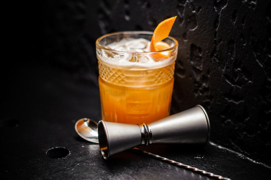 Fresh Orange Alcoholic Drink With Ice And Orange Peel