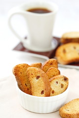Homemade cookies biscotti with berries and cup of coffee