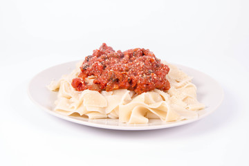 Pappardelle with bolognese sauce on a white background