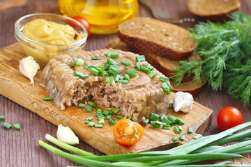 Homemade jelly meat with mustard on the table. Holodets