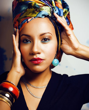 beauty bright african woman with creative make up, shawl on head like cubian