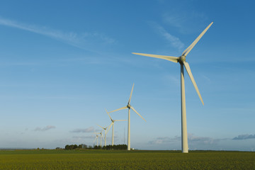 Wind turbines of a power plant for electricity generation in Normandy, France. Concept of renewable sources of energy. Environmentally friendly electricity production. Toned